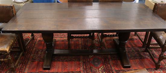 An oak refectory table fitted three-plank top on turned bulbous supports, 214 x 94cm